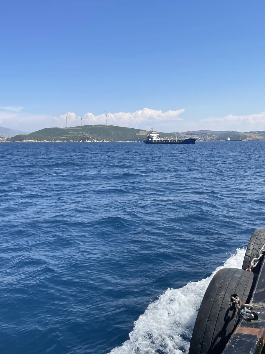 The launch heading out to a ship at anchor